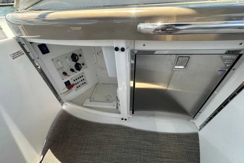 Yacht Photos Pics 2018 Formula 370 Super Sport boat interior with control panel and storage compartment.