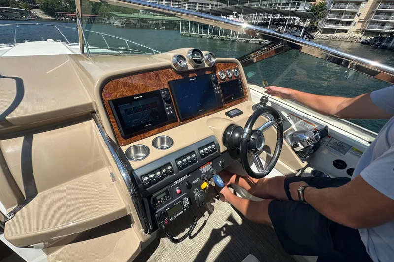  Yacht Photos Pics 2018 Formula 370 Super Sport boat cockpit with advanced navigation controls and steering wheel.