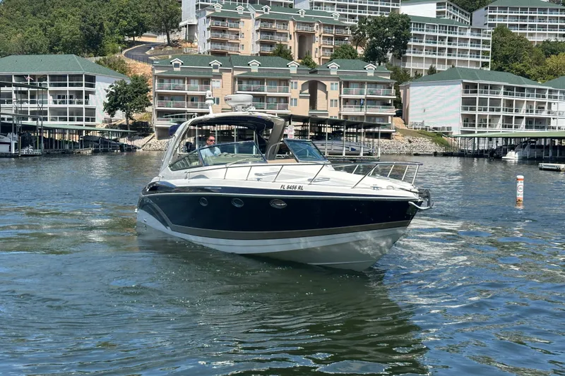  Yacht Photos Pics 2018 Formula 370 Super Sport boat cruising near waterfront buildings.