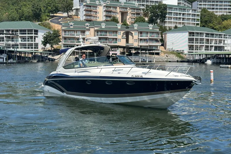  Yacht Photos Pics 2018 Formula 370 Super Sport boat cruising near waterfront buildings.