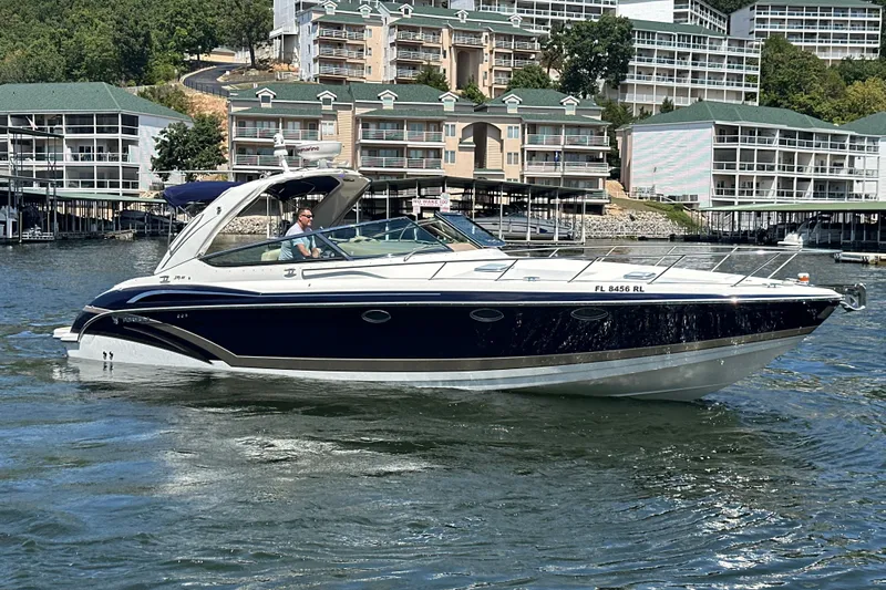  Yacht Photos Pics 2018 Formula 370 Super Sport boat cruising on a lake near waterfront buildings.