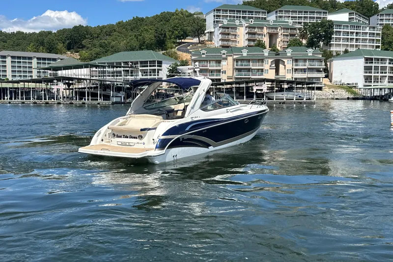  Yacht Photos Pics 2018 Formula 370 Super Sport boat on a lake with waterfront buildings.