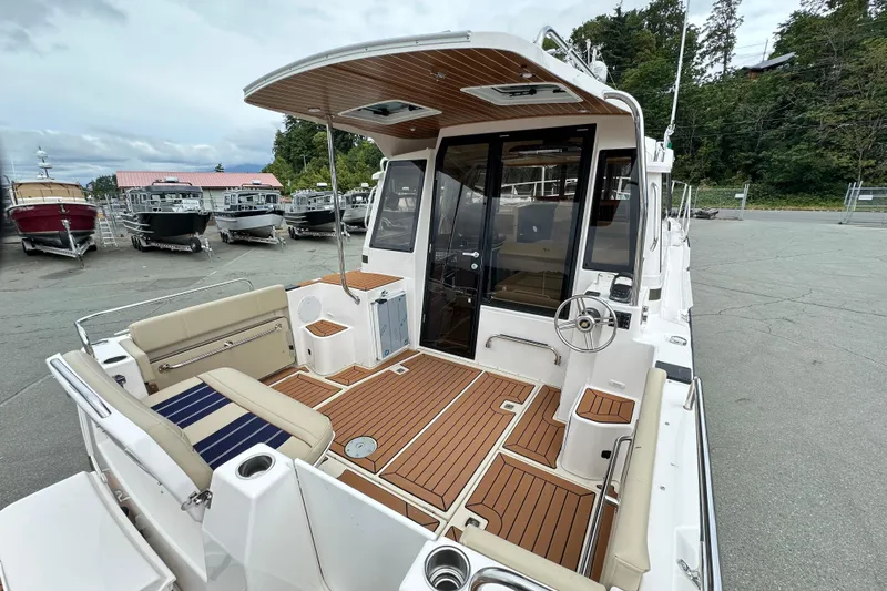  Yacht Photos Pics 2025 Ranger Tugs R-29S boat with spacious deck and modern design in marina setting.