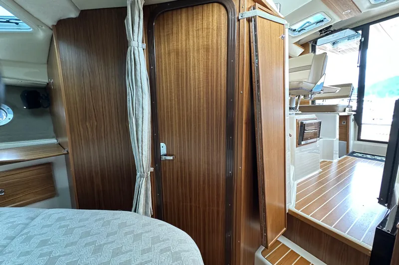  Yacht Photos Pics 2025 Ranger Tugs R-29S interior with wood finish and modern design elements.