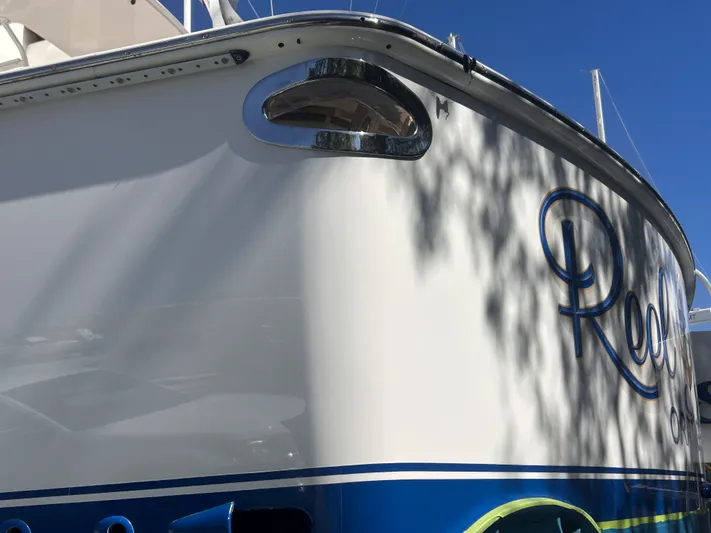 Reel Blessed Yacht Photos Pics Viking ENC FB 2014 boat hull with blue lettering.