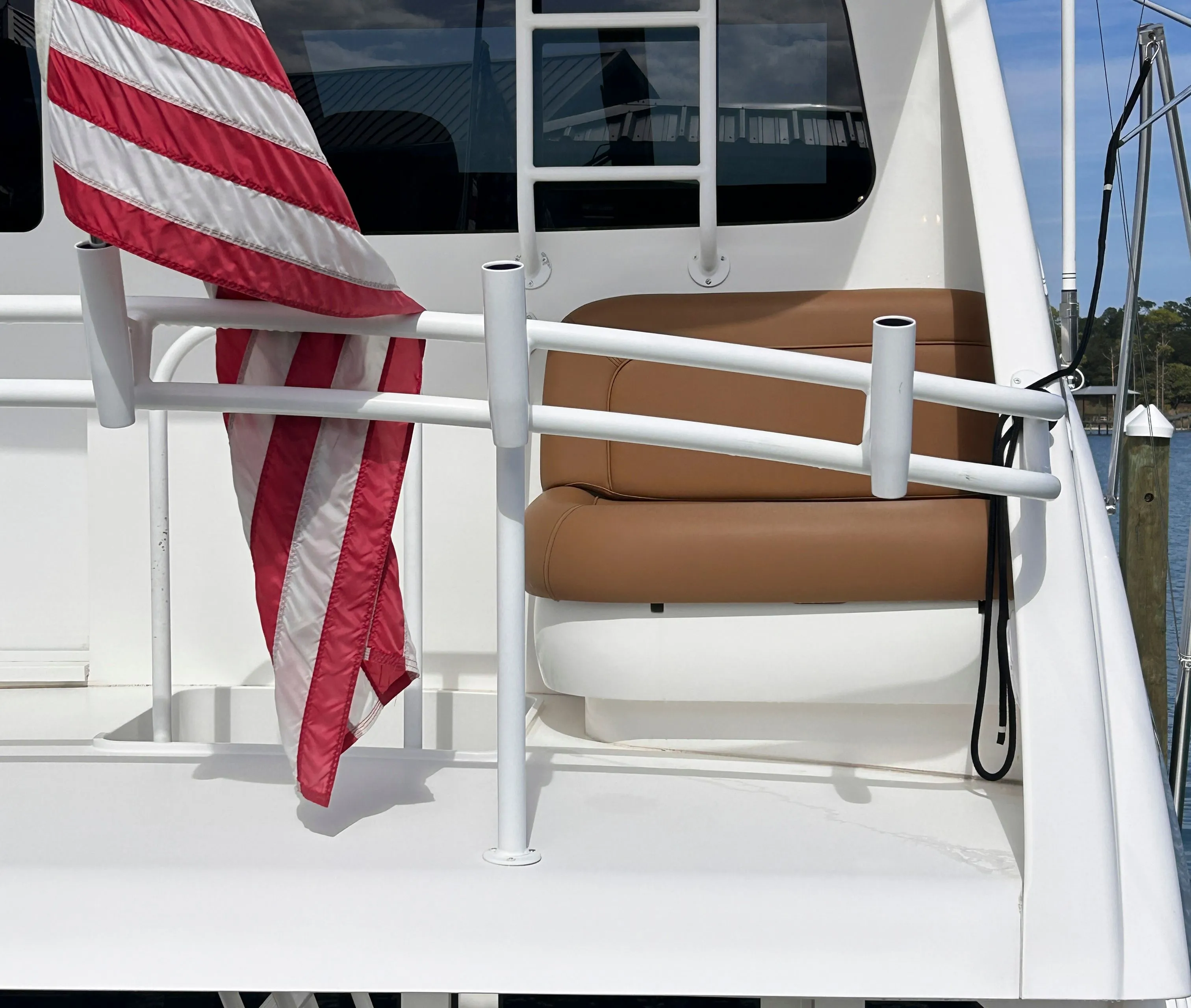 Viking ENC FB 2014 yacht with American flag and seating area.