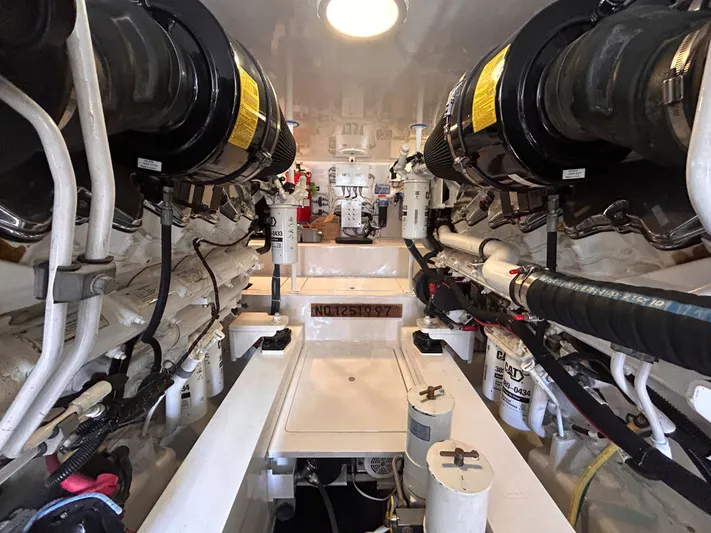 Reel Blessed Yacht Photos Pics Engine room of a 2014 Viking ENC FB boat with complex machinery.