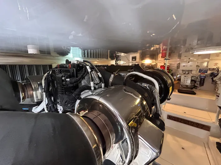Reel Blessed Yacht Photos Pics Engine room of a 2014 Viking ENC FB boat with shiny components.