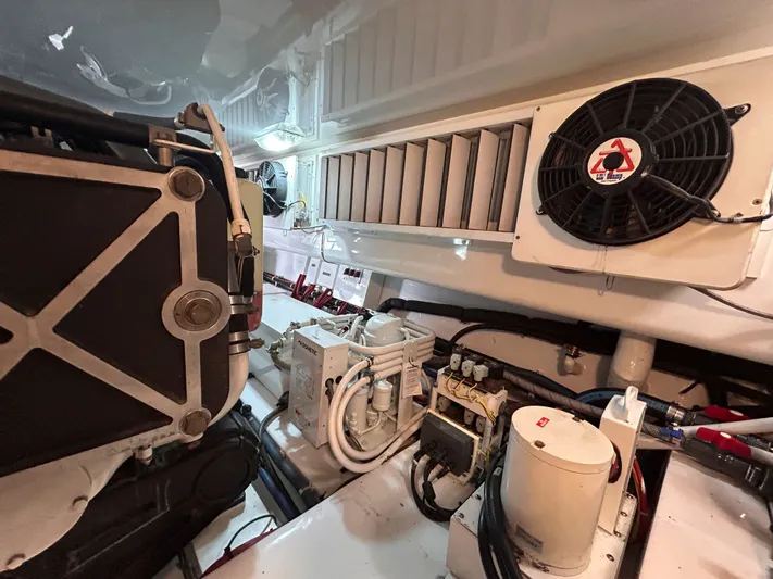 Reel Blessed Yacht Photos Pics Engine room of a 2014 Viking ENC FB with fan and hoses.