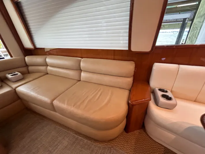 Reel Blessed Yacht Photos Pics Interior of a 2014 Viking ENC FB yacht with leather sofas.