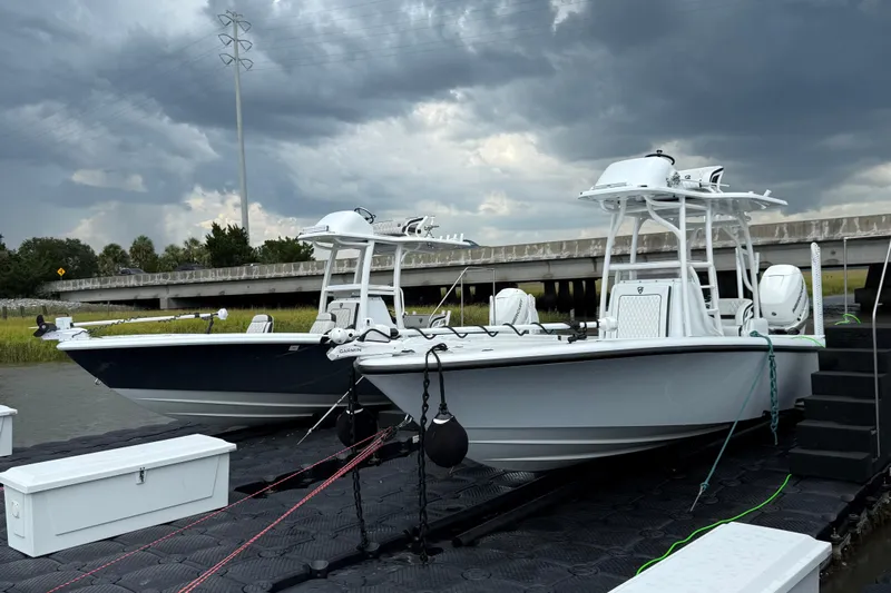  Yacht Photos Pics 2019 Barker Boatworks 26 Open boats docked under stormy skies.