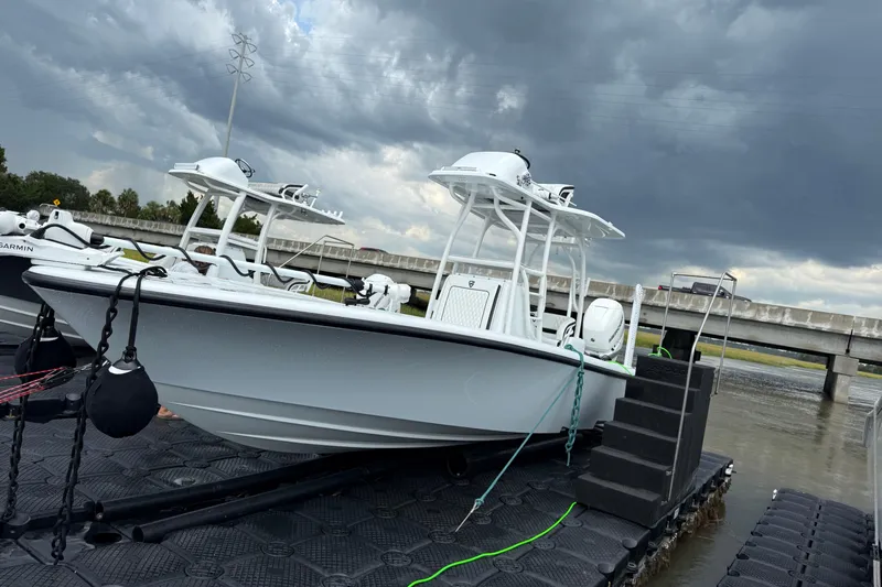  Yacht Photos Pics 2019 Barker Boatworks 26 Open on dock under cloudy sky.