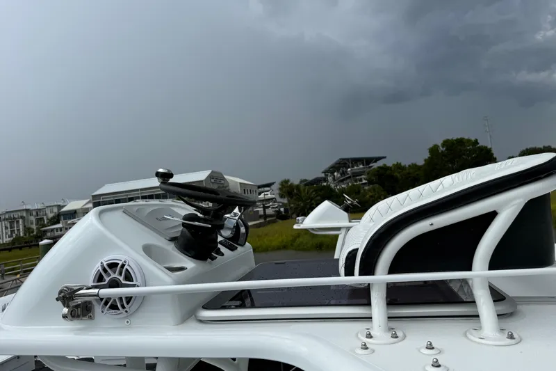  Yacht Photos Pics 2019 Barker Boatworks 26 Open with stormy sky backdrop at marina.