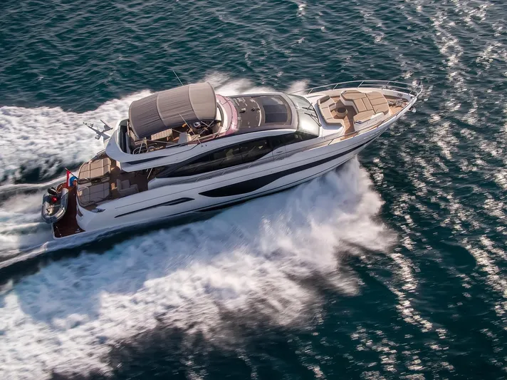  Yacht Photos Pics Luxurious 2019 Princess S78 yacht cruising swiftly on open water.