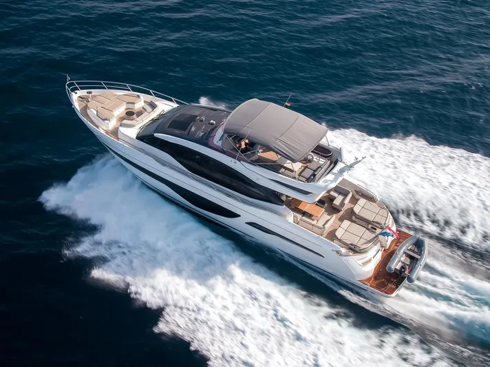  Yacht Photos Pics Luxurious 2019 Princess S78 yacht cruising on open water, aerial view.