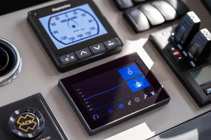  Yacht Photos Pics Control panel of a 2019 Princess S78 yacht with digital displays and controls.