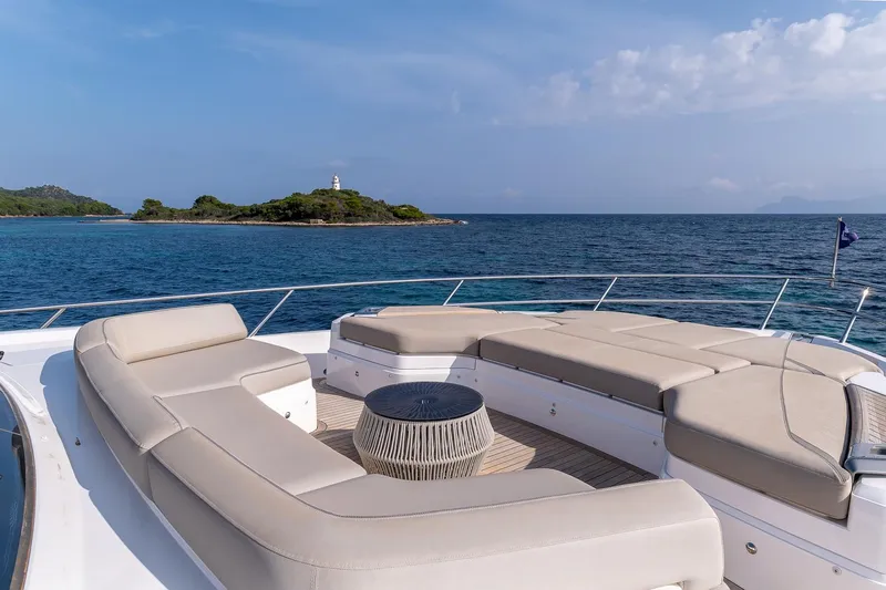  Yacht Photos Pics Luxurious 2019 Princess S78 yacht deck with ocean view and island in the background.