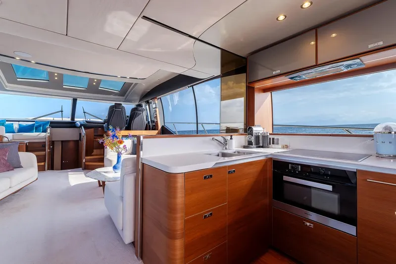  Yacht Photos Pics Luxurious interior of 2019 Princess S78 yacht with modern kitchen and panoramic windows.