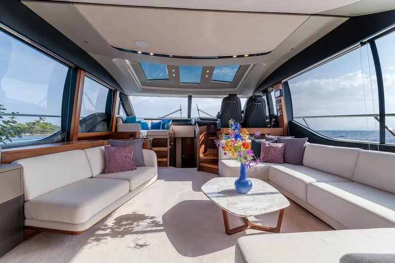  Yacht Photos Pics Luxurious interior of 2019 Princess S78 yacht with elegant seating and panoramic windows.