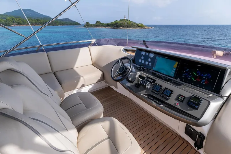  Yacht Photos Pics Luxurious 2019 Princess S78 yacht cockpit with modern controls and ocean view.