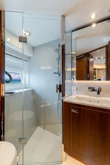  Yacht Photos Pics Luxurious bathroom in 2019 Princess S78 yacht with glass shower and modern fixtures.