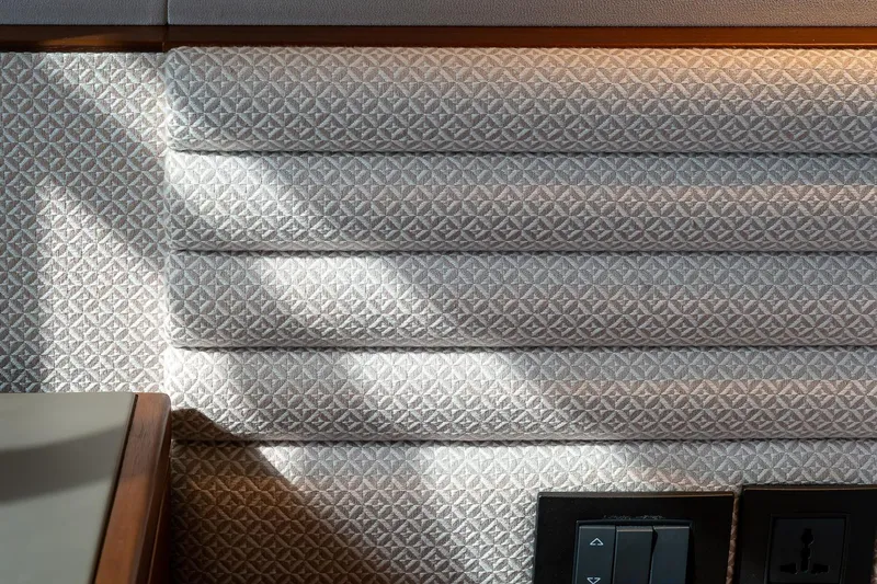  Yacht Photos Pics Interior detail of 2019 Princess S78 yacht with patterned upholstery and control panel.