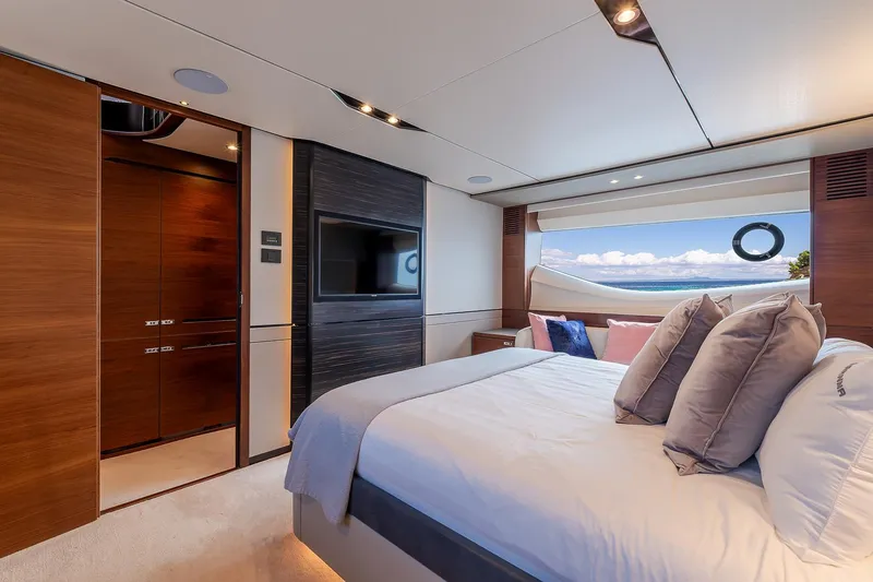  Yacht Photos Pics Luxurious bedroom interior of 2019 Princess S78 yacht with ocean view.