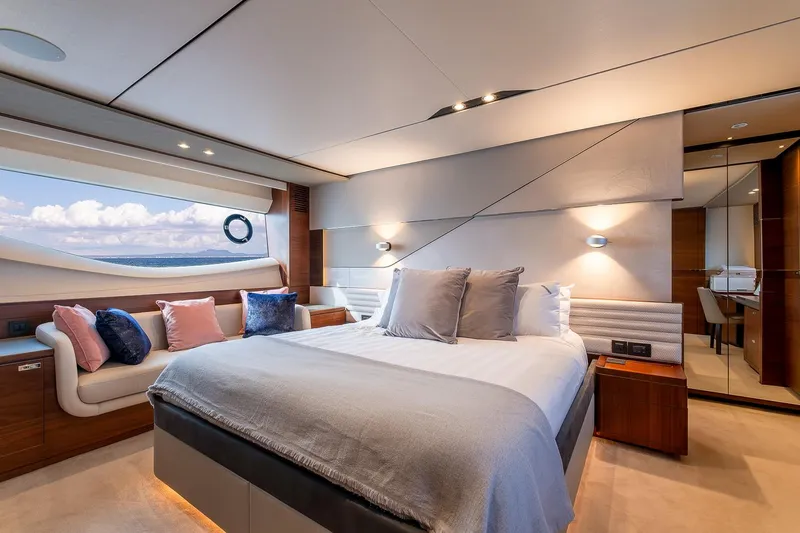  Yacht Photos Pics Luxurious bedroom interior of 2019 Princess S78 yacht with ocean view and elegant decor.