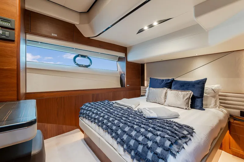 Yacht Photos Pics Luxurious bedroom interior of 2019 Princess S78 yacht with elegant bedding and modern design.