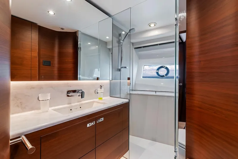  Yacht Photos Pics Luxurious bathroom on 2019 Princess S78 yacht with modern fixtures and wood accents.