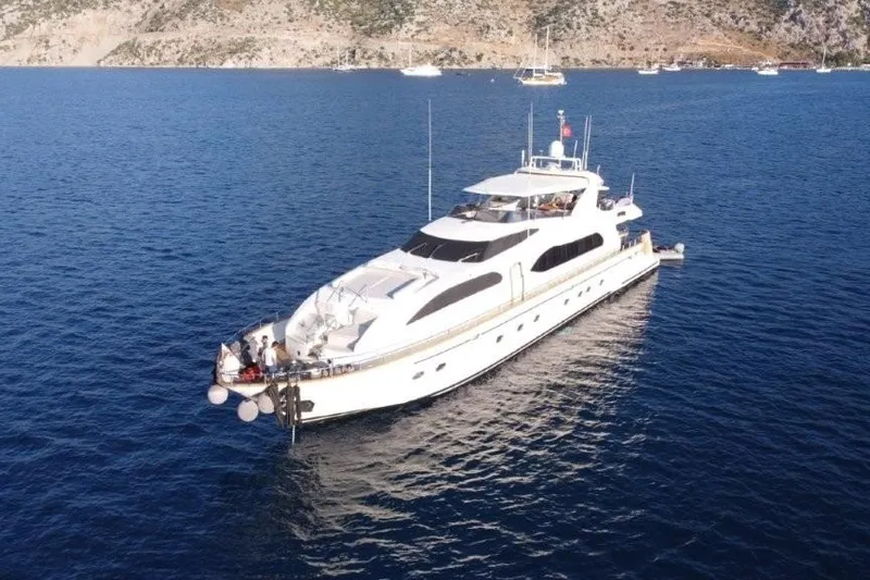  Yacht Photos Pics Luxurious 2008 Falcon 102 HT yacht cruising in serene blue waters.