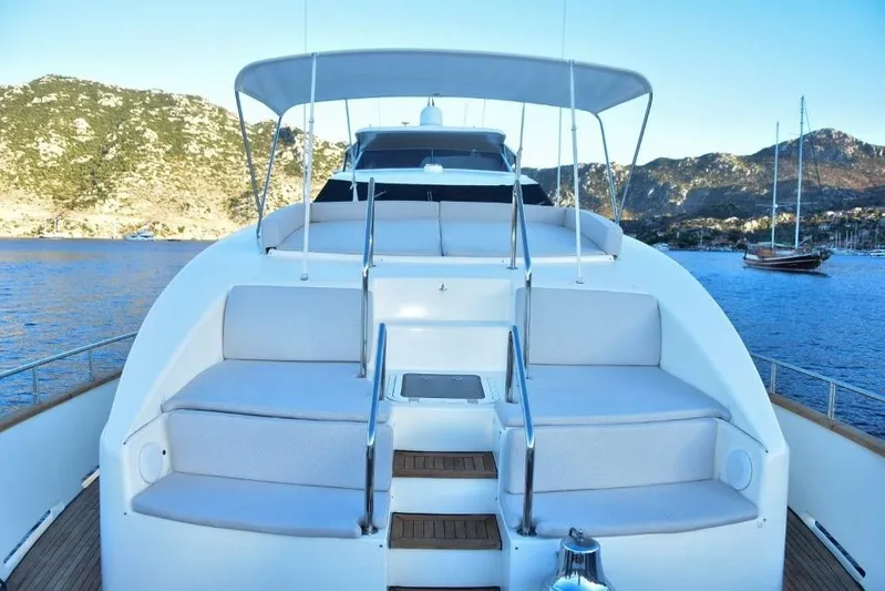 Yacht Photos Pics Luxury Falcon 102 HT yacht deck with seating, scenic coastal view, 2008 model.