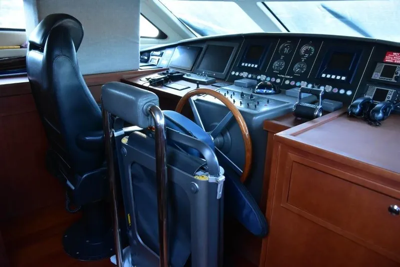  Yacht Photos Pics Cockpit of 2008 Falcon 102 HT yacht with steering wheel and control panels.