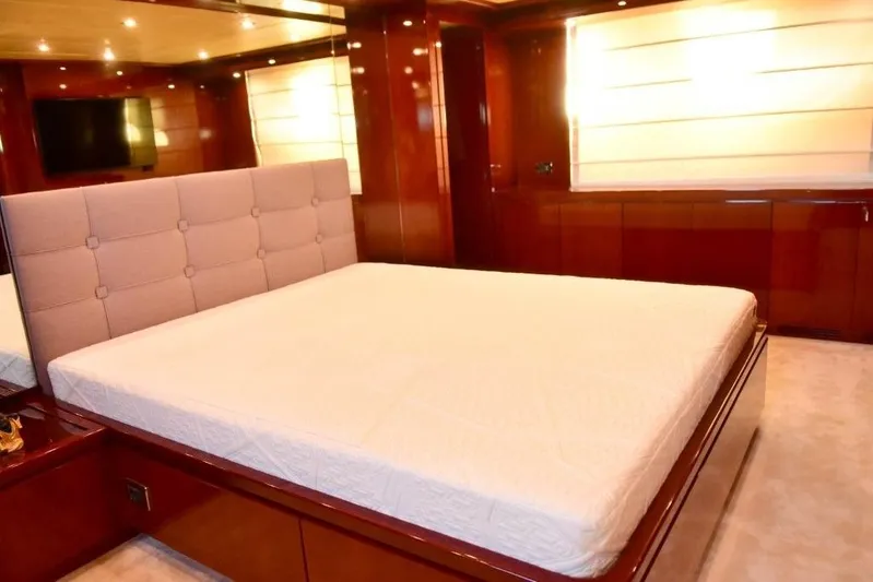  Yacht Photos Pics Luxurious bedroom interior on 2008 Falcon 102 HT yacht with elegant wood finishes.