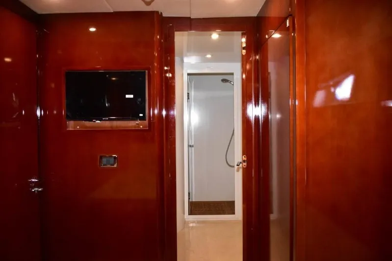  Yacht Photos Pics Luxurious interior of 2008 Falcon 102 HT yacht with glossy wood finish and modern amenities.