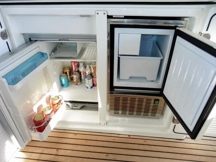  Yacht Photos Pics Refrigerator and freezer on 2017 Jeanneau Leader 46 yacht, stocked with beverages.
