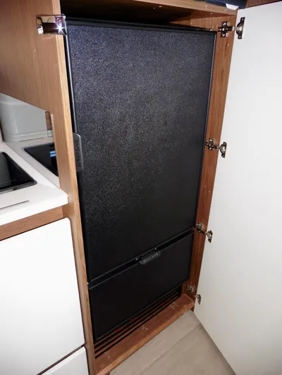  Yacht Photos Pics Built-in refrigerator in 2017 Jeanneau Leader 46 yacht kitchen cabinet.