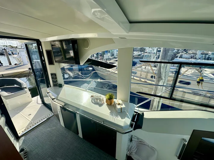  Yacht Photos Pics Interior view of 2020 Galeon 425 HTS yacht with modern design and marina backdrop.