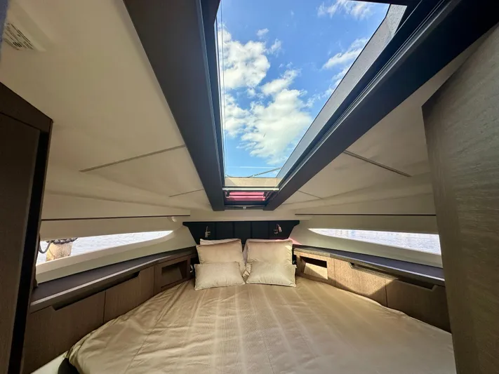  Yacht Photos Pics Luxurious interior of 2020 Galeon 425 HTS yacht with skylight and plush bedding.