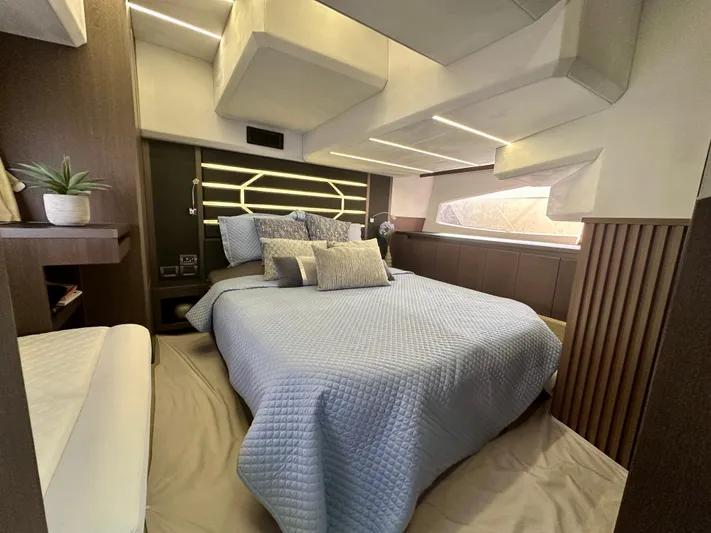  Yacht Photos Pics Luxurious bedroom interior of 2020 Galeon 425 HTS yacht with modern design and cozy bedding.