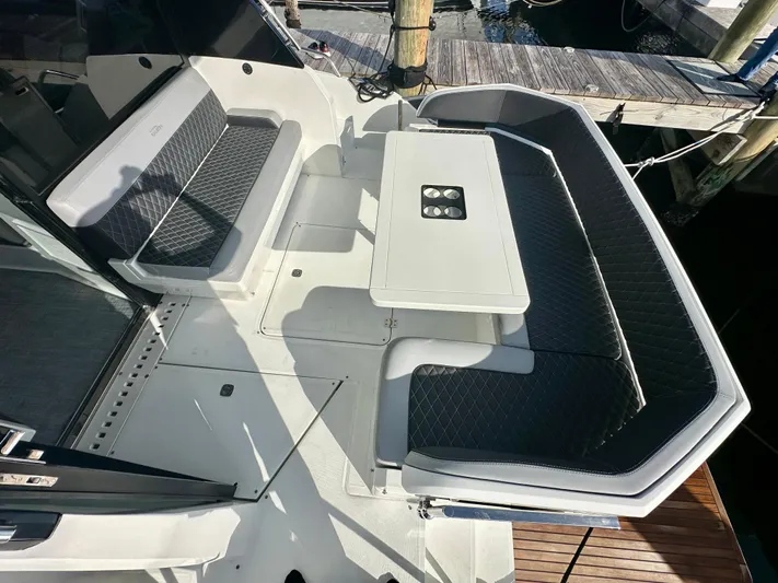  Yacht Photos Pics 2020 Galeon 425 HTS yacht with sleek seating and table on deck.
