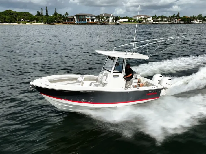 T/t Miss Texas Yacht Photos Pics 2020 Regulator 23 boat cruising on a scenic waterway.