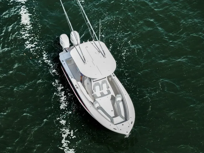 T/t Miss Texas Yacht Photos Pics Aerial view of 2020 Regulator 23 boat cruising on open water.