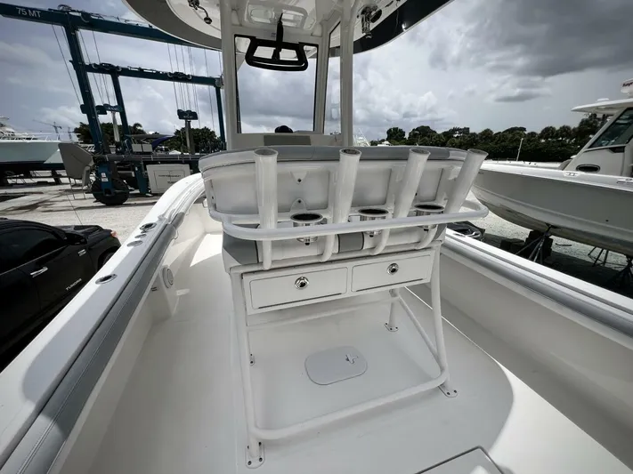 T/t Miss Texas Yacht Photos Pics 2020 Regulator 23 boat interior with rod holders and storage drawers.