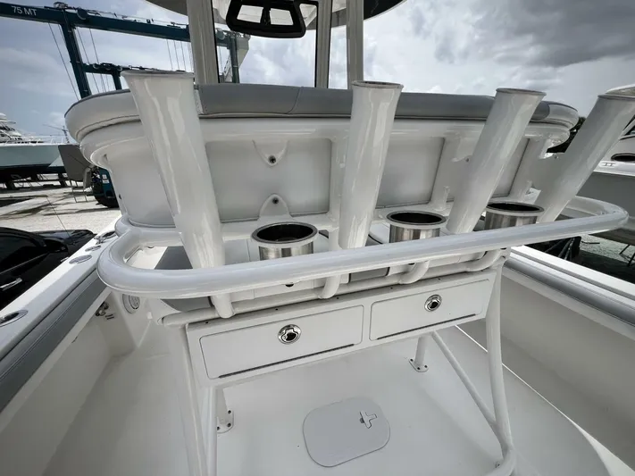 T/t Miss Texas Yacht Photos Pics 2020 Regulator 23 boat interior with rod holders and storage compartments.