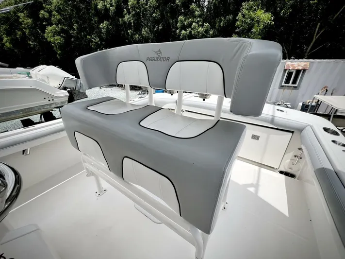 T/t Miss Texas Yacht Photos Pics 2020 Regulator 23 boat seating with gray and white upholstery.