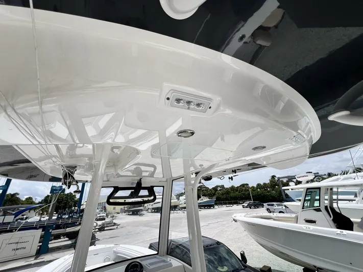 T/t Miss Texas Yacht Photos Pics 2020 Regulator 23 boat with sleek white hardtop and modern design.