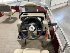 2025 Sun Tracker Bass Buggy® 16 XL Select steering console with beige seating and controls.
