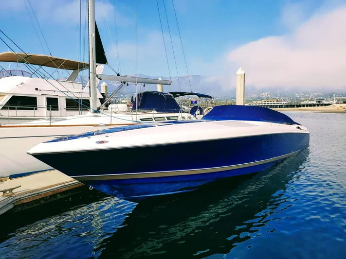  Yacht Photos Pics 2000 Donzi Daytona 45 boat docked in marina, featuring sleek blue and white design.