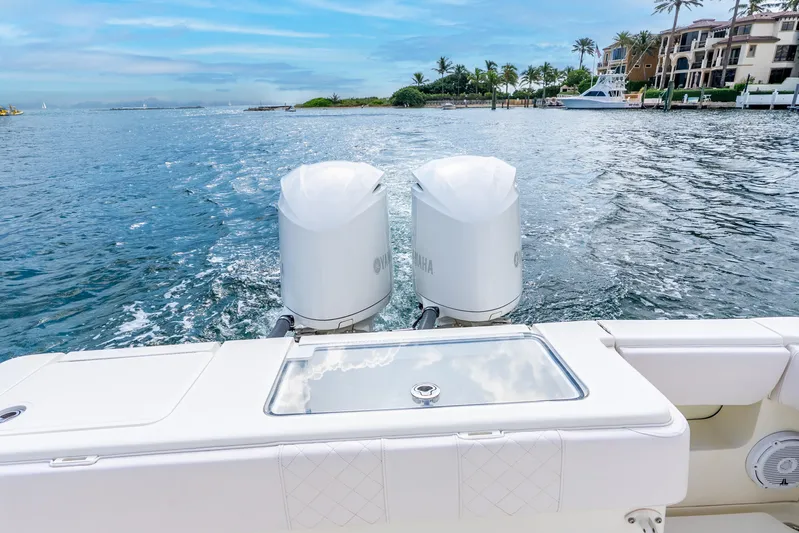  Yacht Photos Pics 2016 SeaVee 340Z boat with dual Yamaha engines cruising on a scenic waterway.